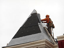 Workers Repairing Roof