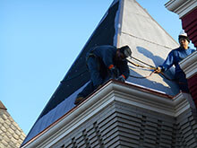 Workers Repairing Roof